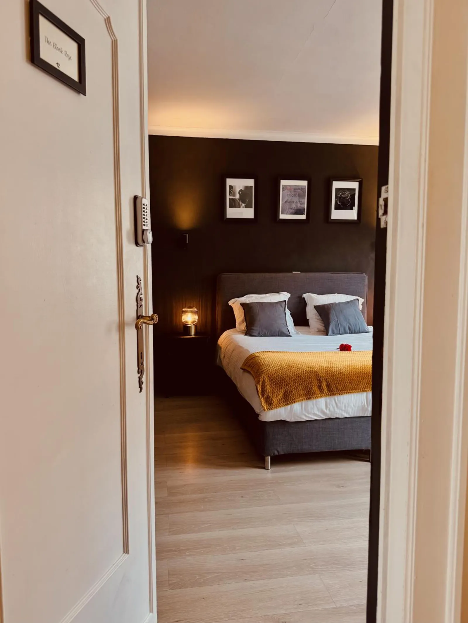 The Cozy Double Room seen through the open door