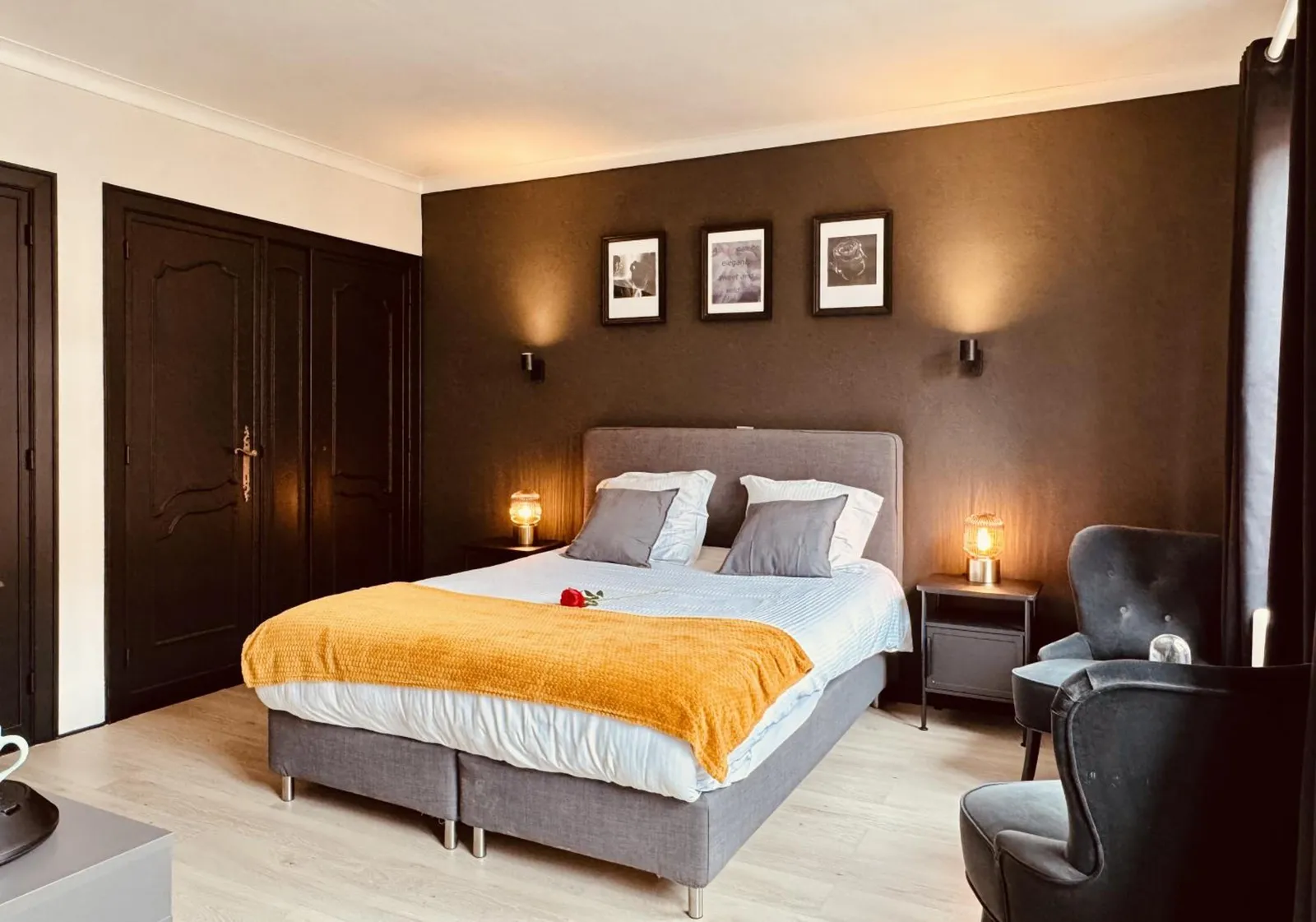 The Cozy Double Room: the double bed with the armchairs
