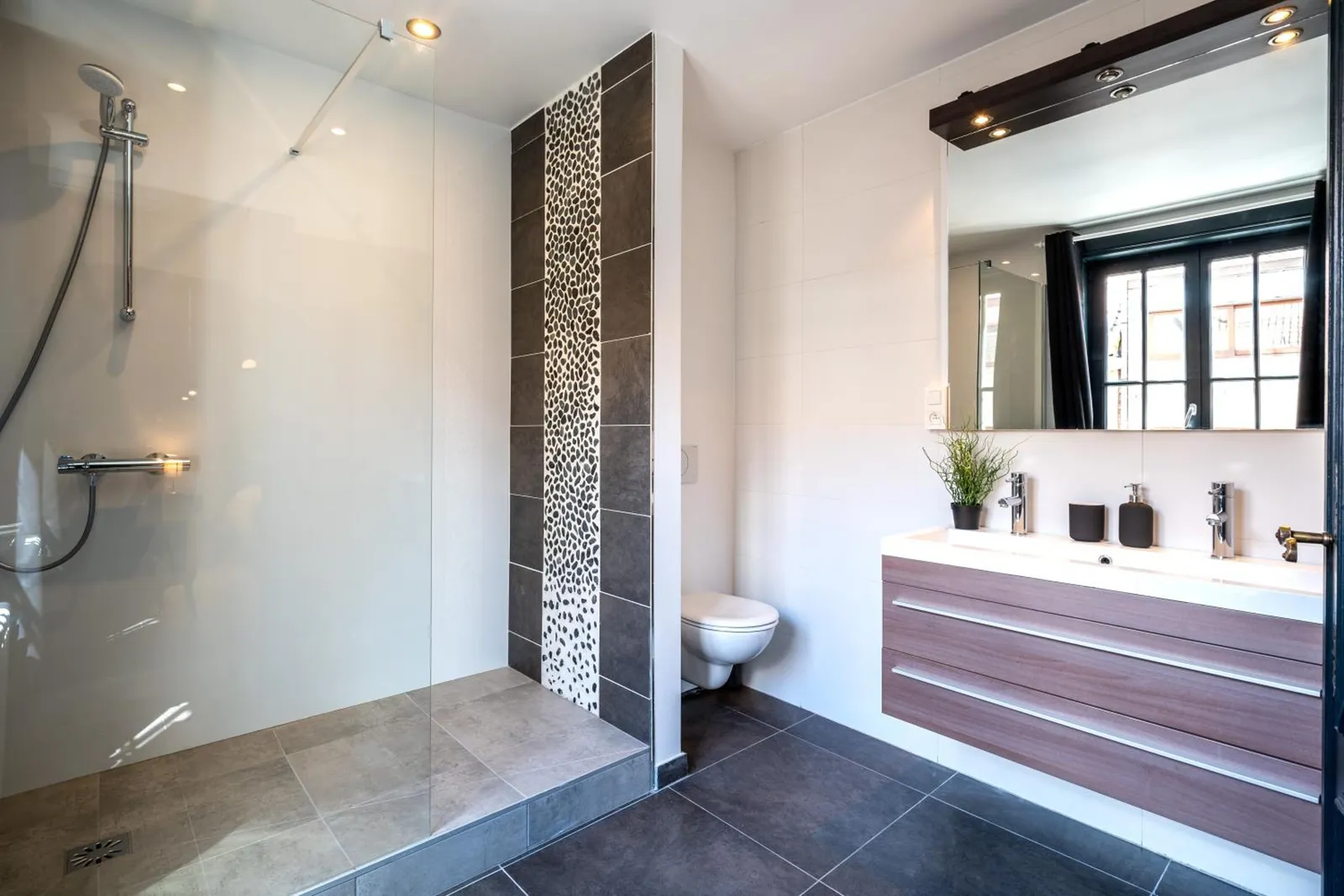 The bathroom of The Cozy Double Room with the shower