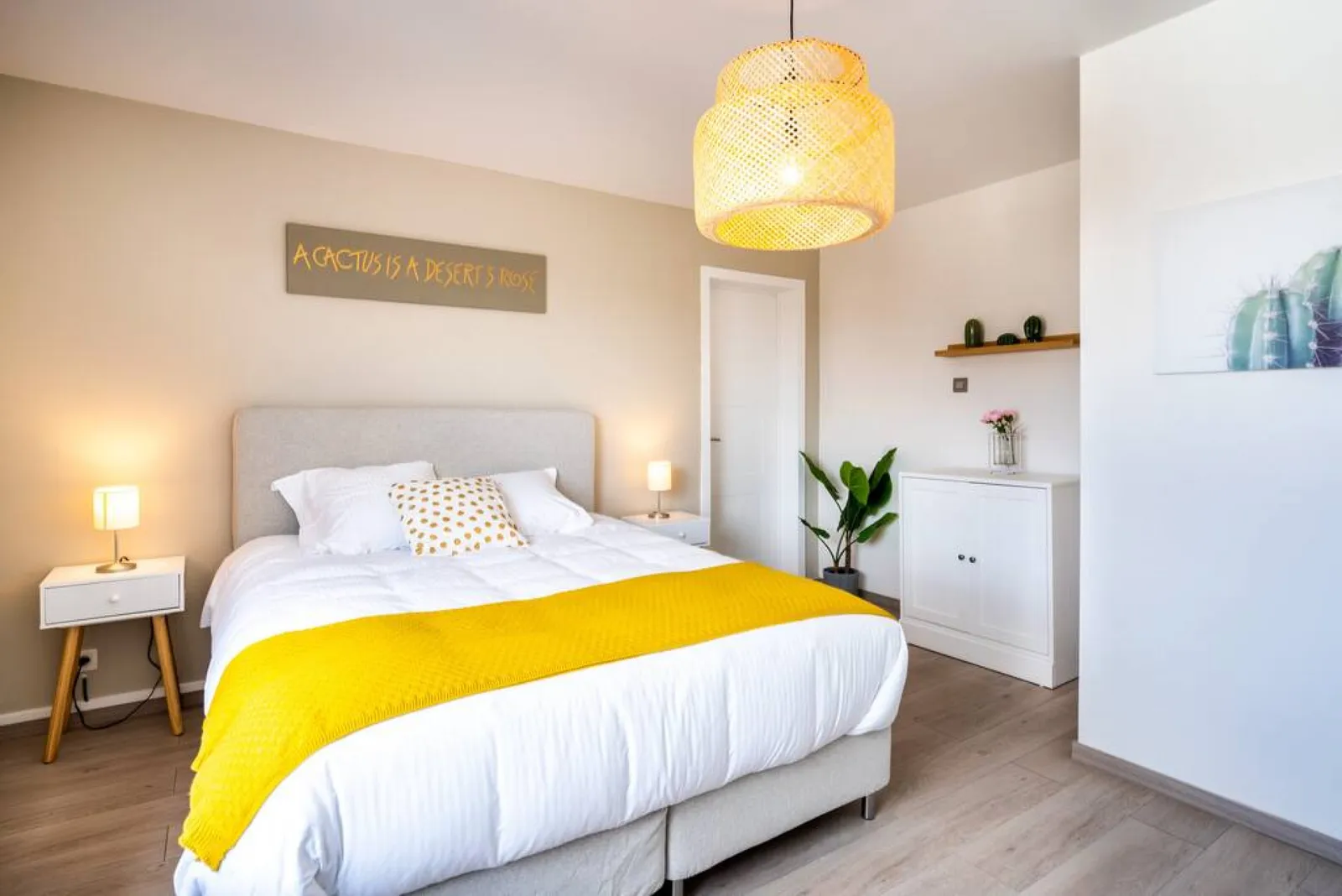One of the two double beds in The Desert Rose, under the name sign