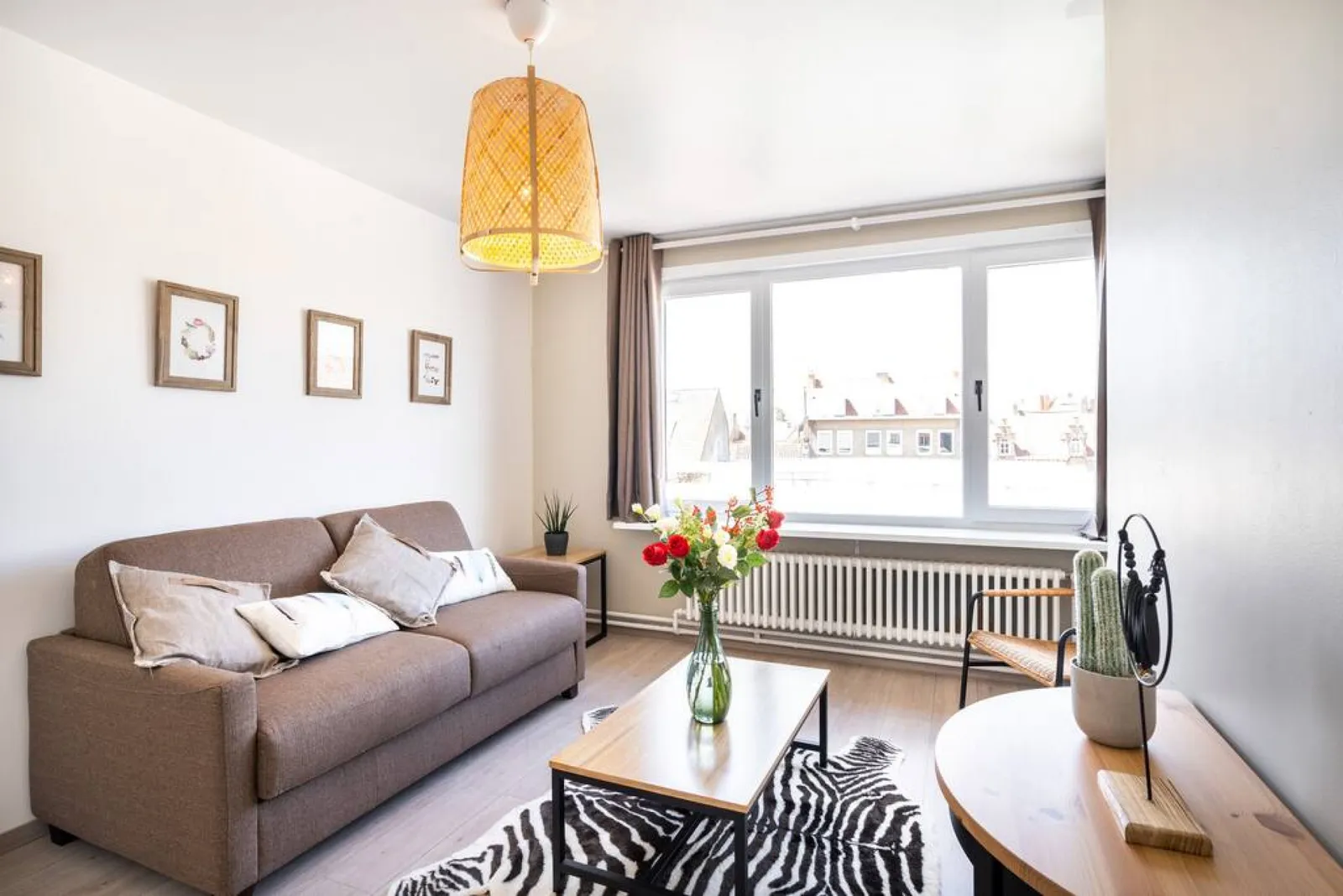 The separate living area of The Desert Rose: the sofa and the window