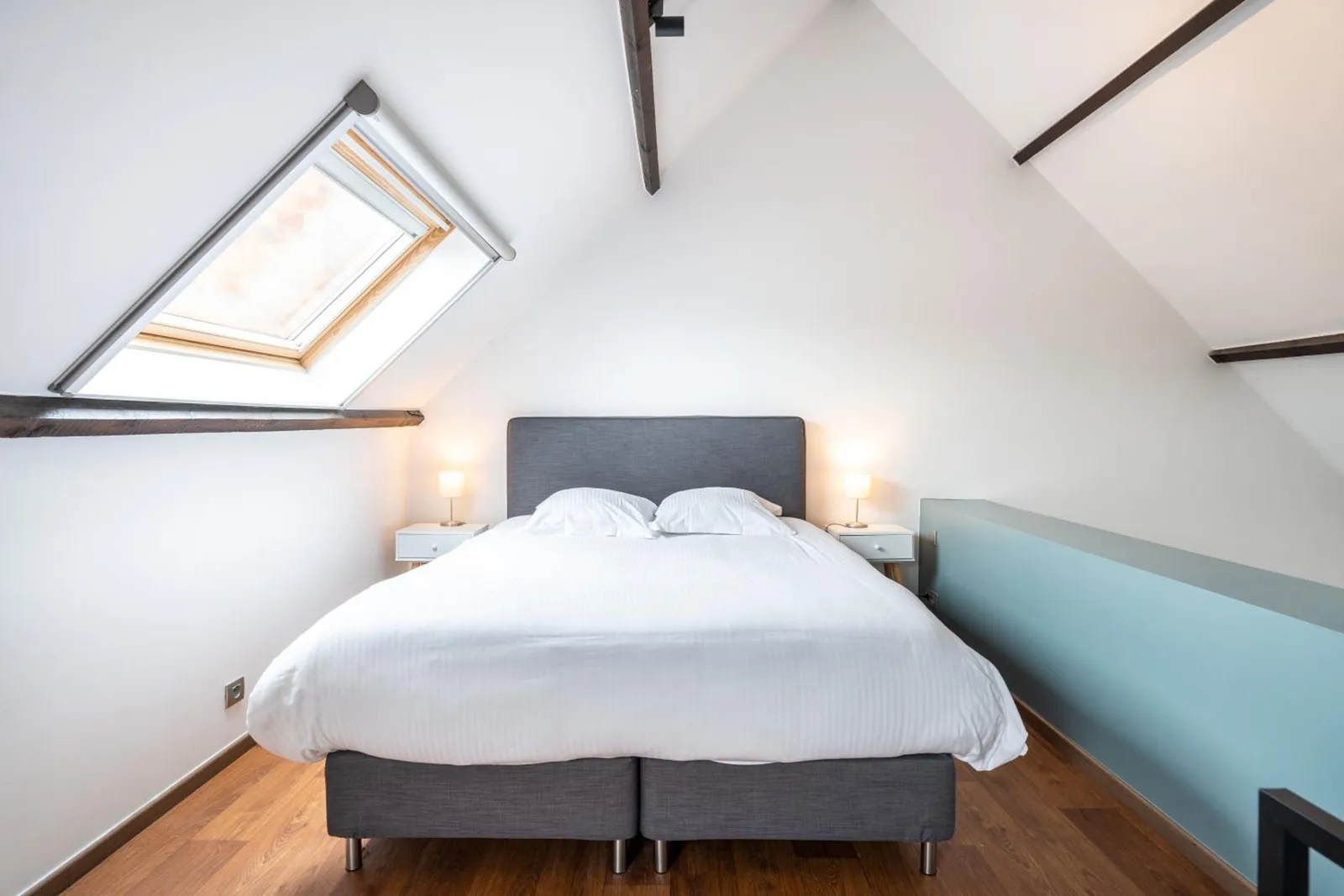 The double bed under the skylight, upstairs in The Rose Tree